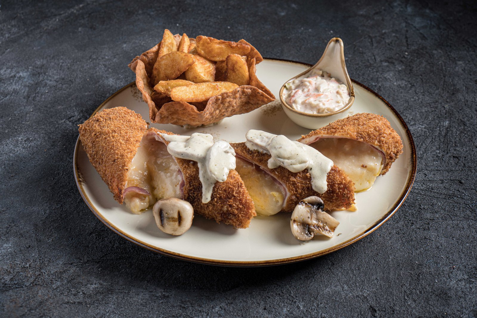 كوردون بلو | Cordon Bleu قطع من رول الدجاج محشوة باللحم المدخن والجبن وصلصة الفطر | Pieces of chicken rolls stuffed with smoked meat, cheese and mushroom sauce